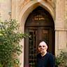 Fayçal Brahimi, commerçant à Arles, ravi devant sa boutique rénovée